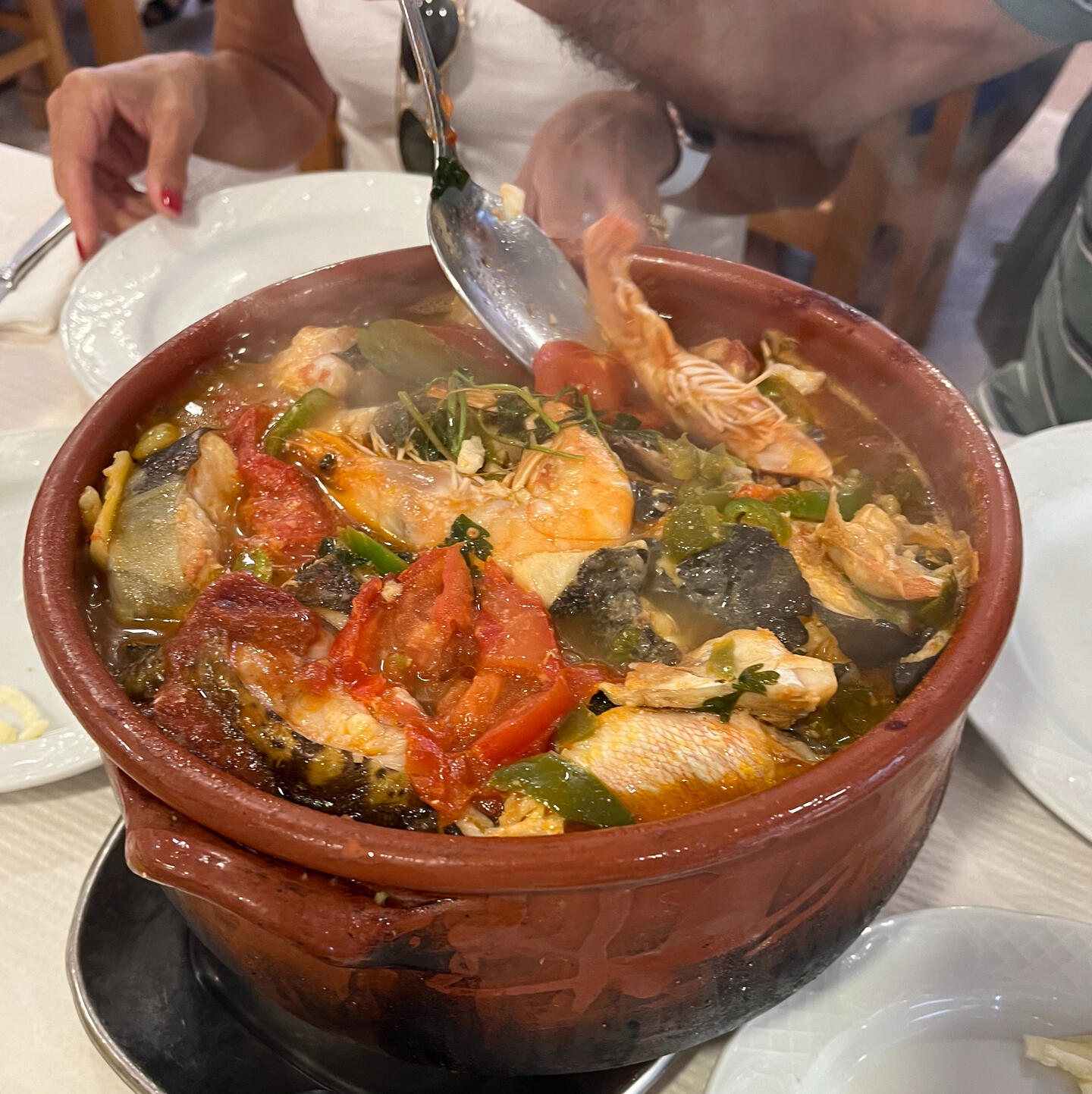 Traditional Portuguese seafood stew in a clay pot
